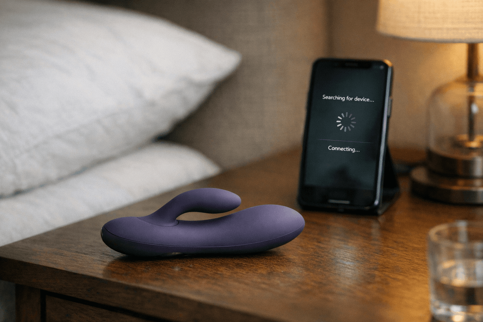 Bluetooth vibrator and smartphone on bedside table